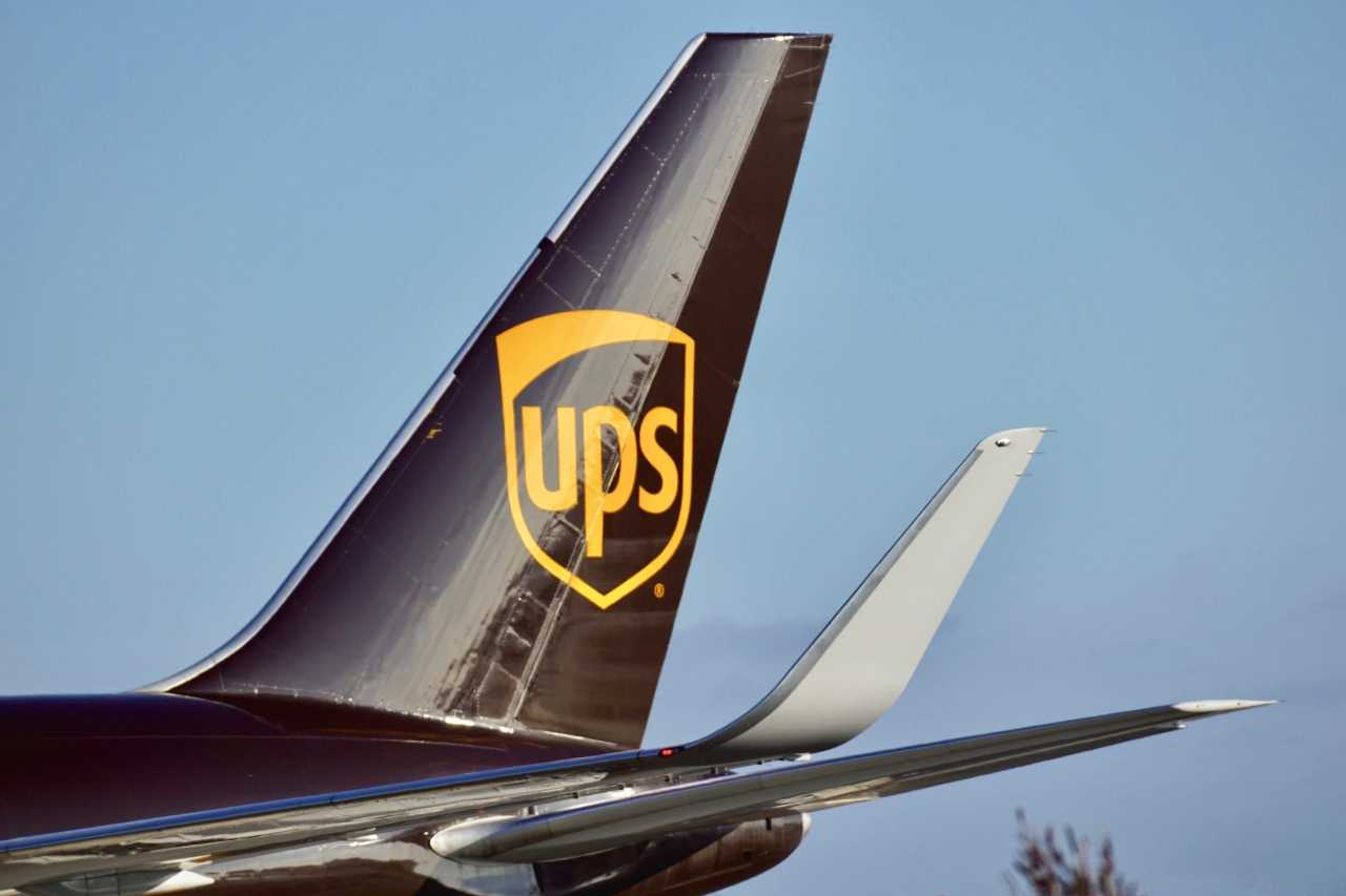 The tail fin of a UPS cargo plane, branded with the UPS logo