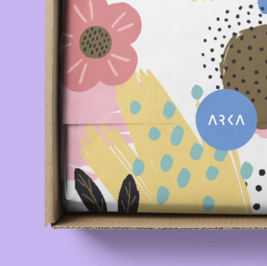 Custom designed tissue paper from Arka inside a brown cardboard box