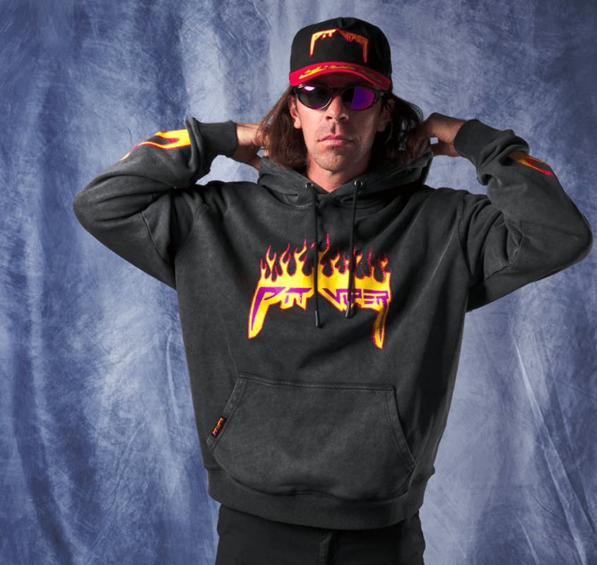 Man wearing a sweatshirt and hat from the accessory and clothing brand, Pit Viper