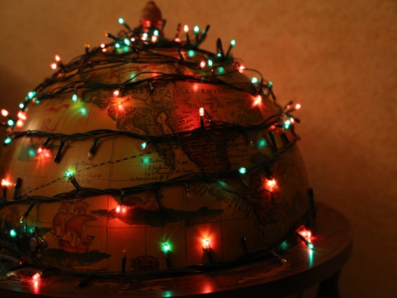 Decorative globe illuminated by Christmas garland_id1598423197