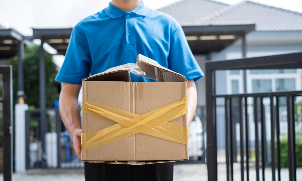 Delivery man Frightened with cardboard box damaged broken accident before delivering to customers at home, Express service client online shopping comfortable payment package product. id_1652140738