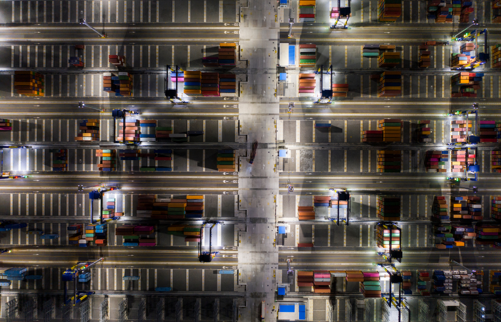 Aerial top view. Container ship in pier with crane bridge carries out export and import business in the open sea at twilight. Logistics and transportation_id1452977291