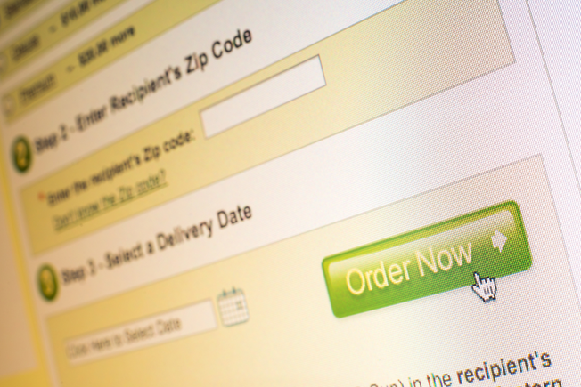 Mouse clicking "order now" button on website while online shopping _id283395728