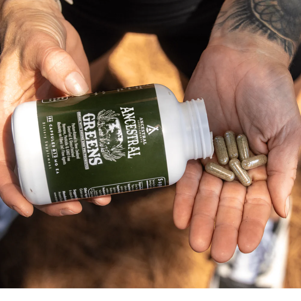 Ancestral Supplements being poured out of the bottle into someone's hand