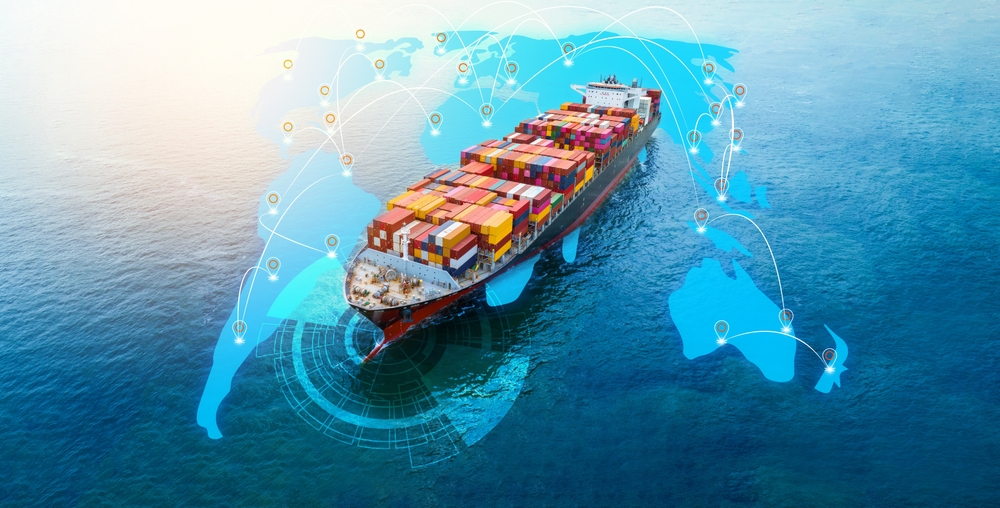 Cargo ship on the ocean with a global map in the background
