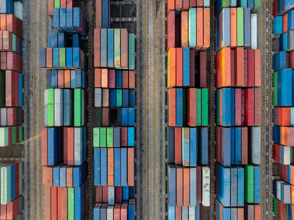 Stacked cargo containers top down aerial view. Containers at logistics terminal center. Cargo container outdoor warehouse_id2465134369
