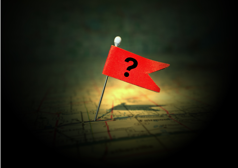 Red flag pin on a map in spotlight_id1054175822