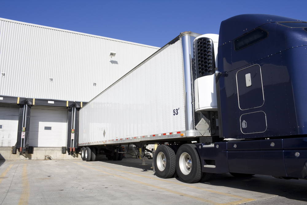 Blue Transport Truck Docking in warehouse_id63541162
