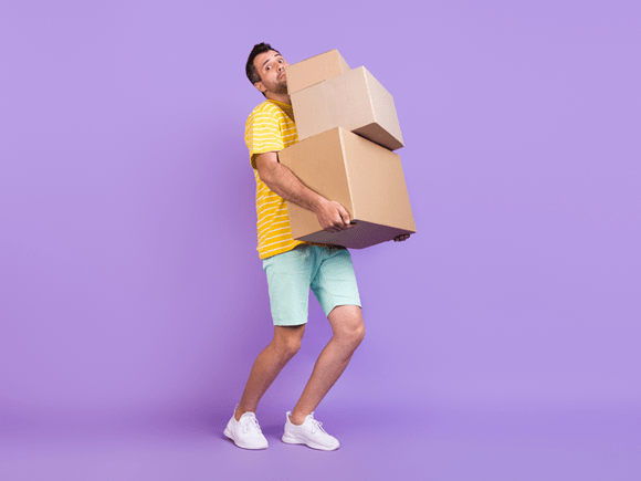 Full length photo of unhappy upset man hold heavy boxes bad mood move property isolated on violet color background_id2017000556