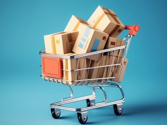 A shopping cart full of boxes on a blue background_id2309087499