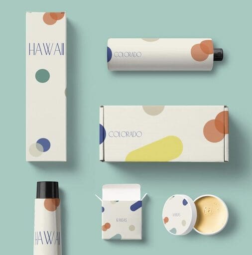 A variety of paperboard boxes and containers, all branded for Arka