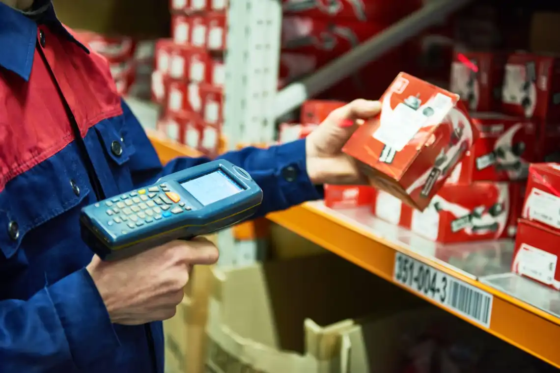 A warehouse workers scans