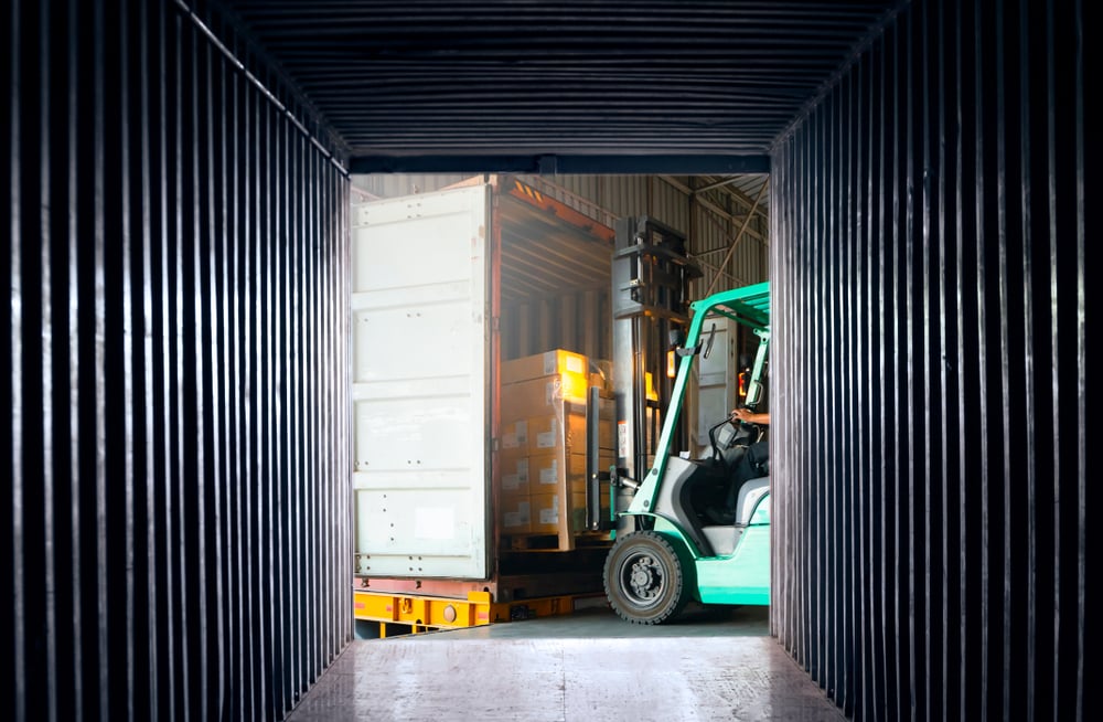 Freight transportation. Logistic concept Internal view an empty container shipping, forklift loading shipment pallet into container cargo._id1314988193
