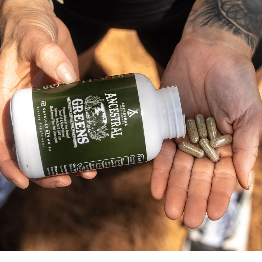 Ancestral Supplements being poured out of the bottle into someone's hand
