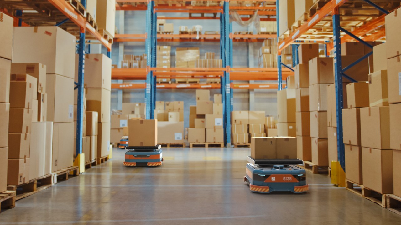 Autonomous mobile robots (AMRs) roaming through a warehouse